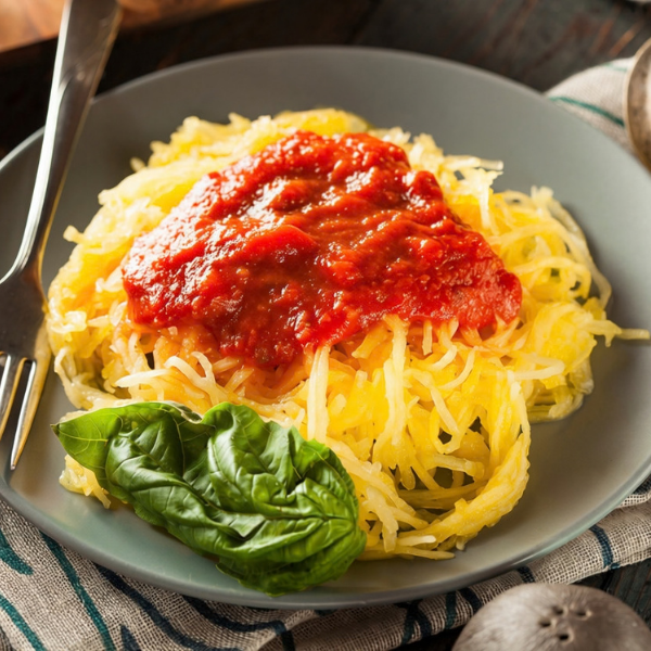 Spaghetti squash with grass-fed meat sauce in a bowl — a hormone-supporting fall recipe